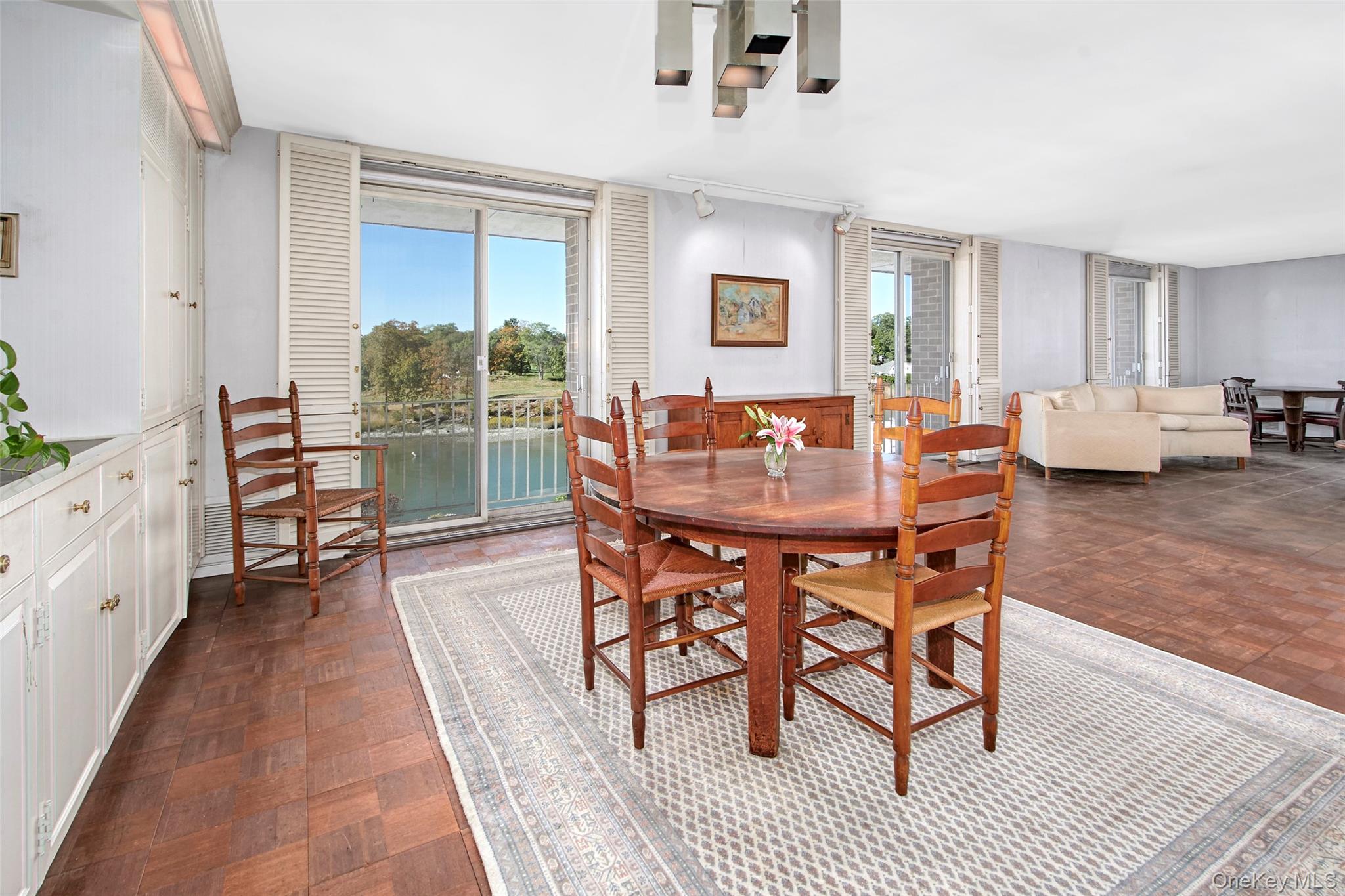 720 Milton Road, Unit 4C WEST Rye, NY 10580 - Photo 16 of 21 a dining room with furniture and wooden floor