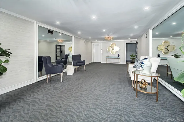 a living room with furniture a dining table and a potted plant