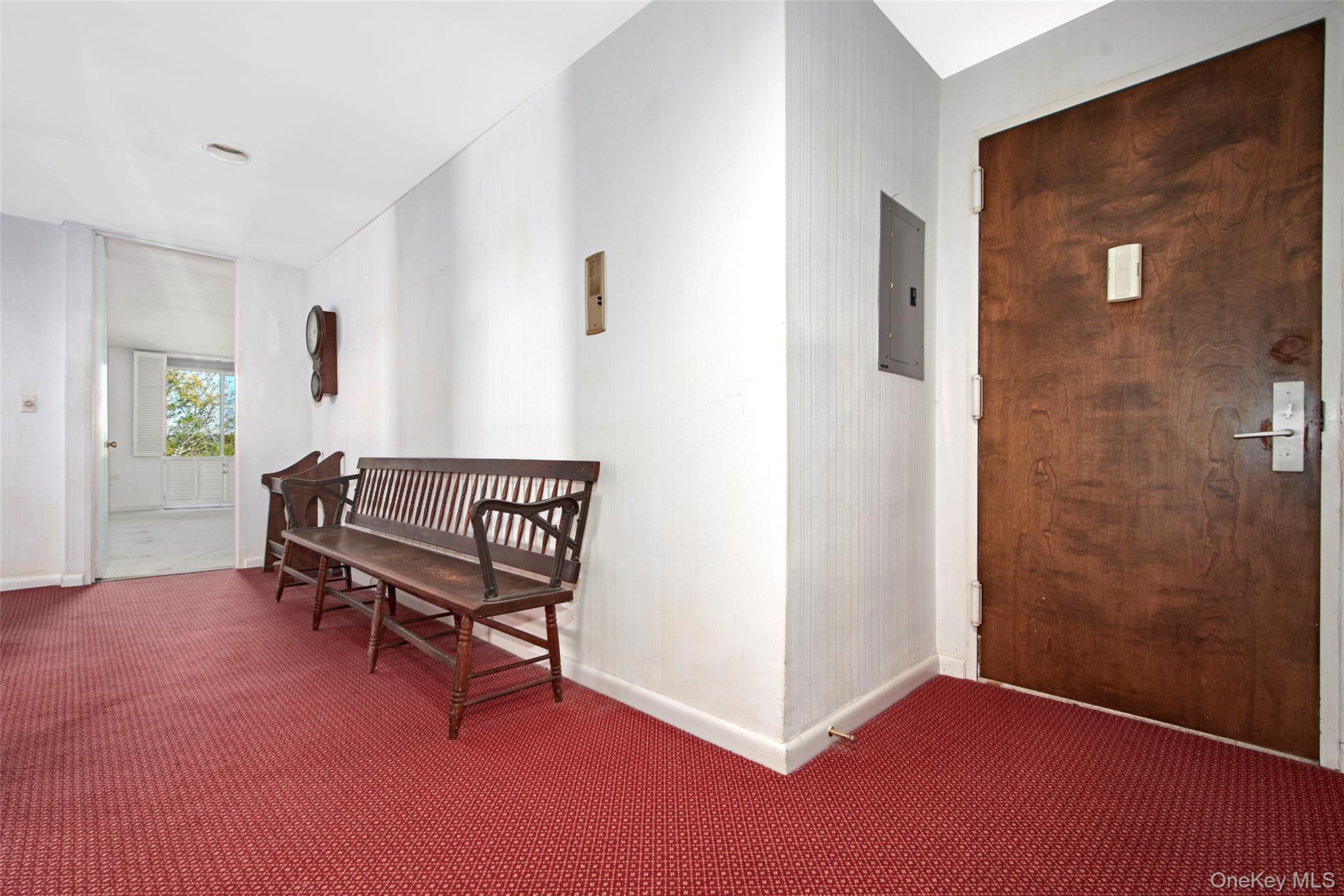 720 Milton Road, Unit 4C WEST Rye, NY 10580 - Photo 5 of 21 a view of a hallway with a door and a couch