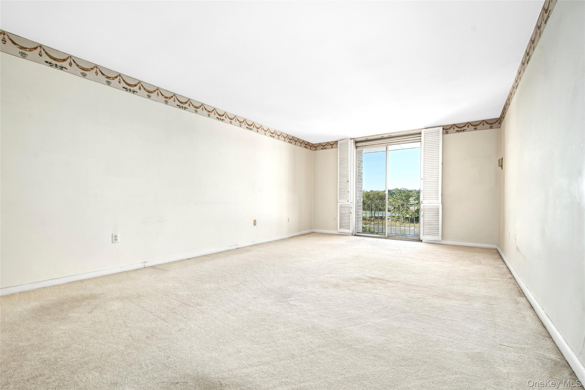 720 Milton Road, Unit 4C WEST Rye, NY 10580 - Photo 6 of 21 a view of an empty room with a window