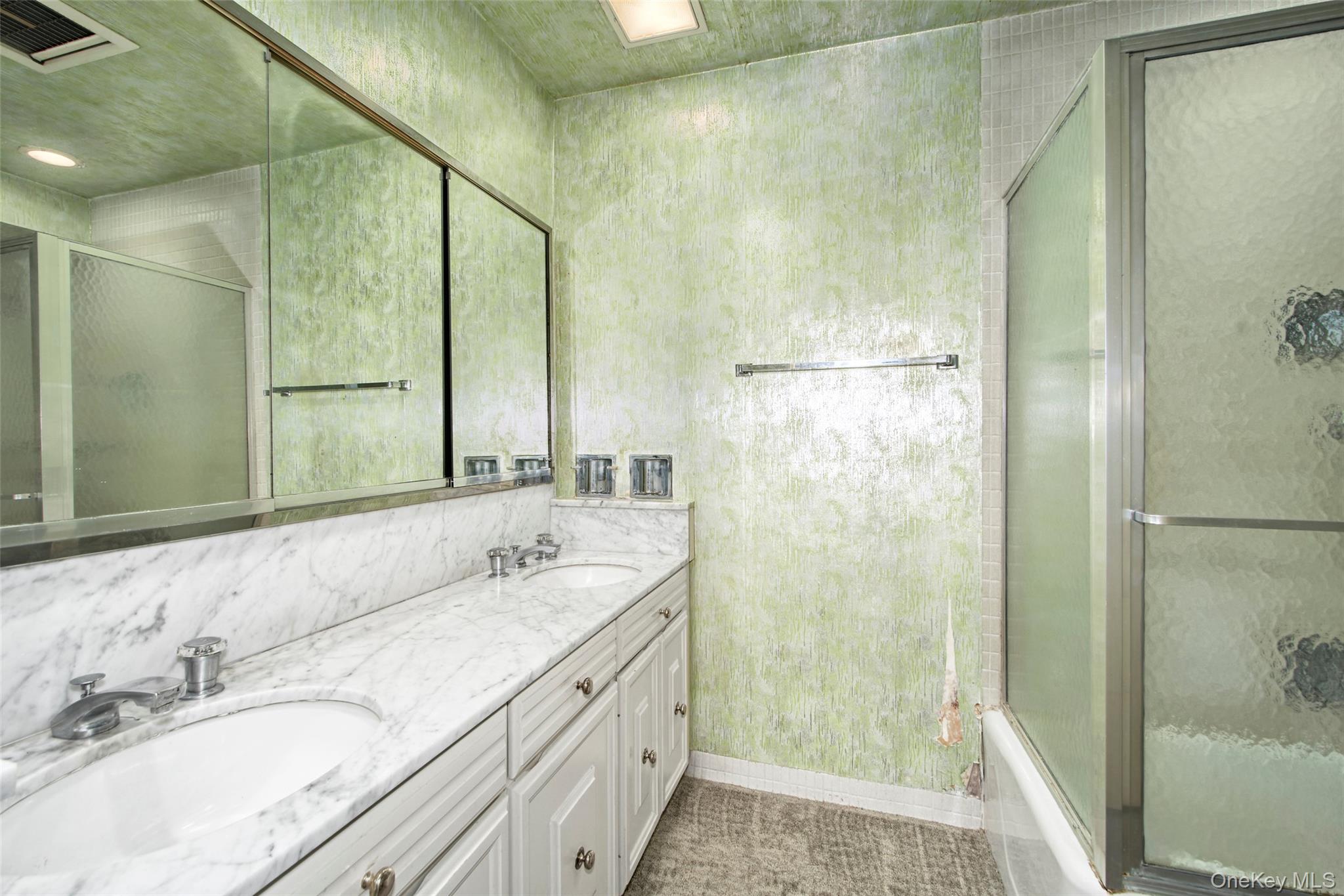 720 Milton Road, Unit 4C WEST Rye, NY 10580 - Photo 7 of 21 a bathroom with a granite countertop shower sink and mirror