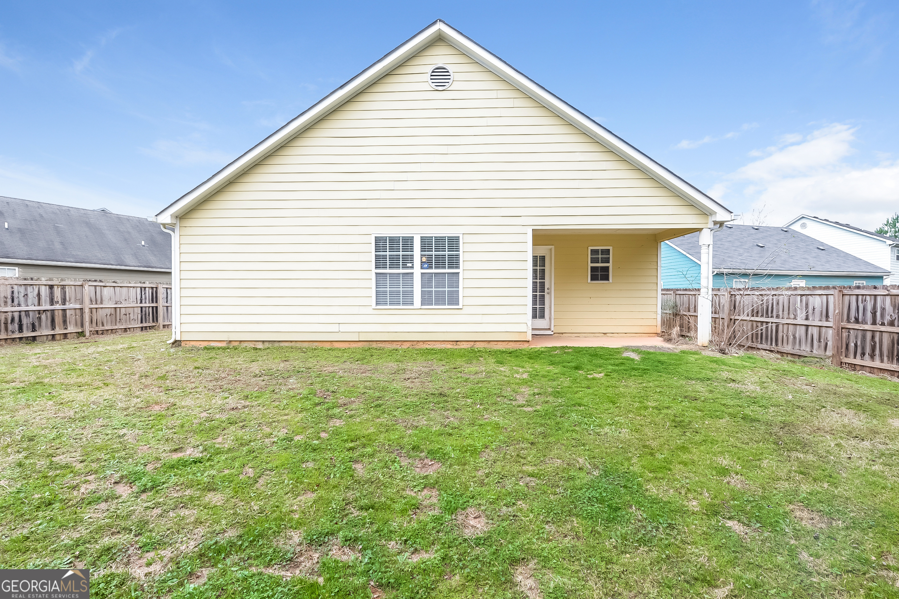 5179 Tew Lane Southwest Covington, GA 30014 - Photo 15 of 16 a view of a house with a backyard