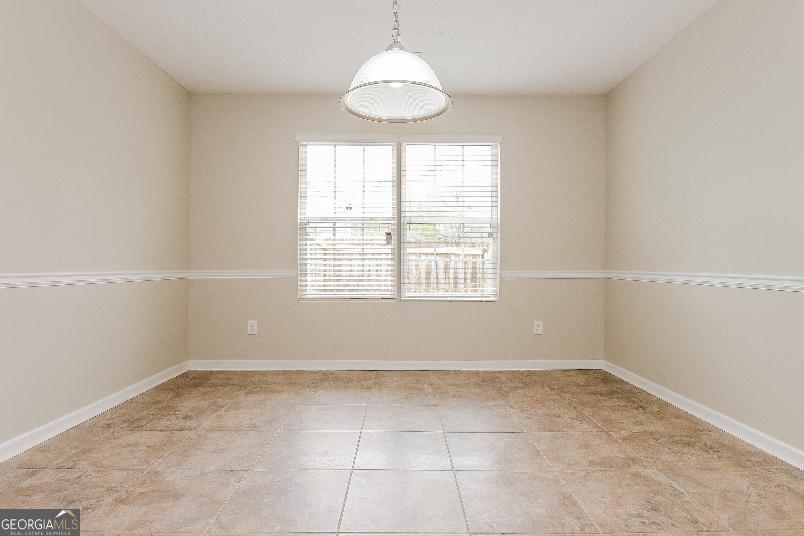 5179 Tew Lane Southwest Covington, GA 30014 - Photo 5 of 16 an empty room with a window