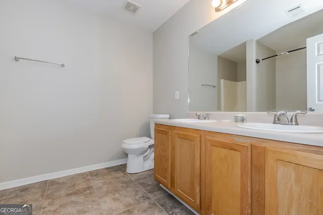 a bathroom with a sink and a toilet