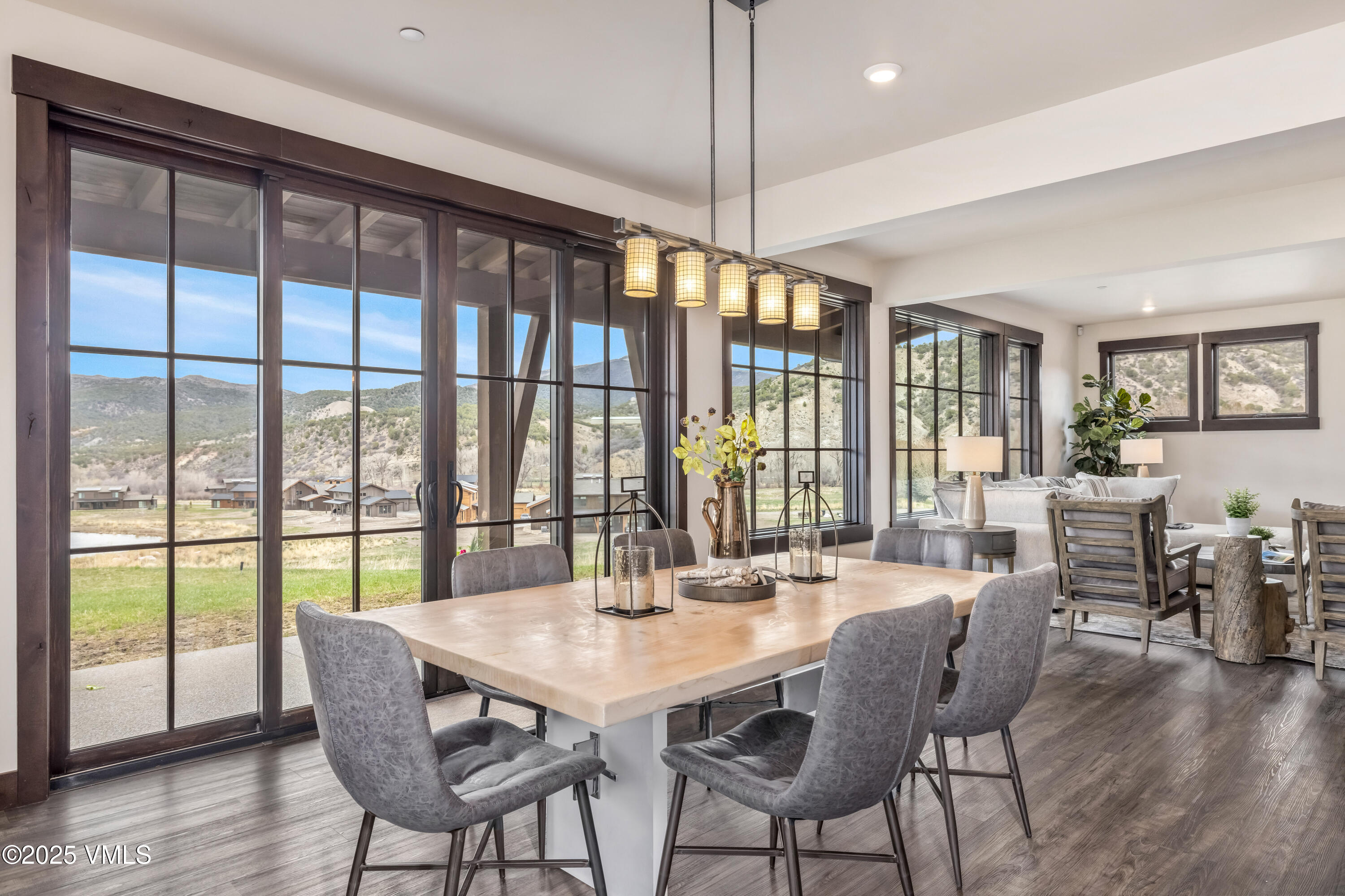86 Hunters View Lane Eagle, CO 81631 - Photo 11 of 28 a view of a dining room with furniture window and wooden floor