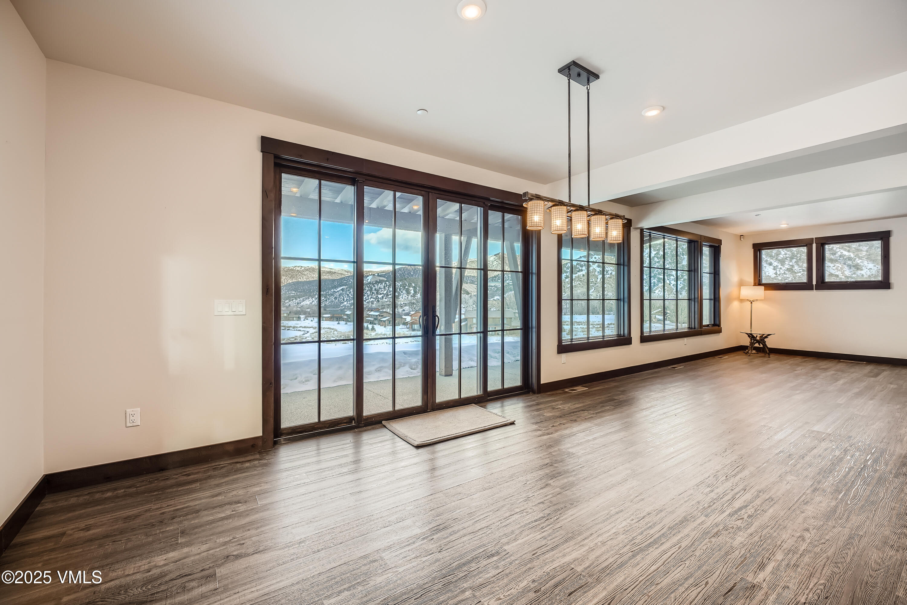 86 Hunters View Lane Eagle, CO 81631 - Photo 12 of 28 a view of empty room with wooden floor and fan