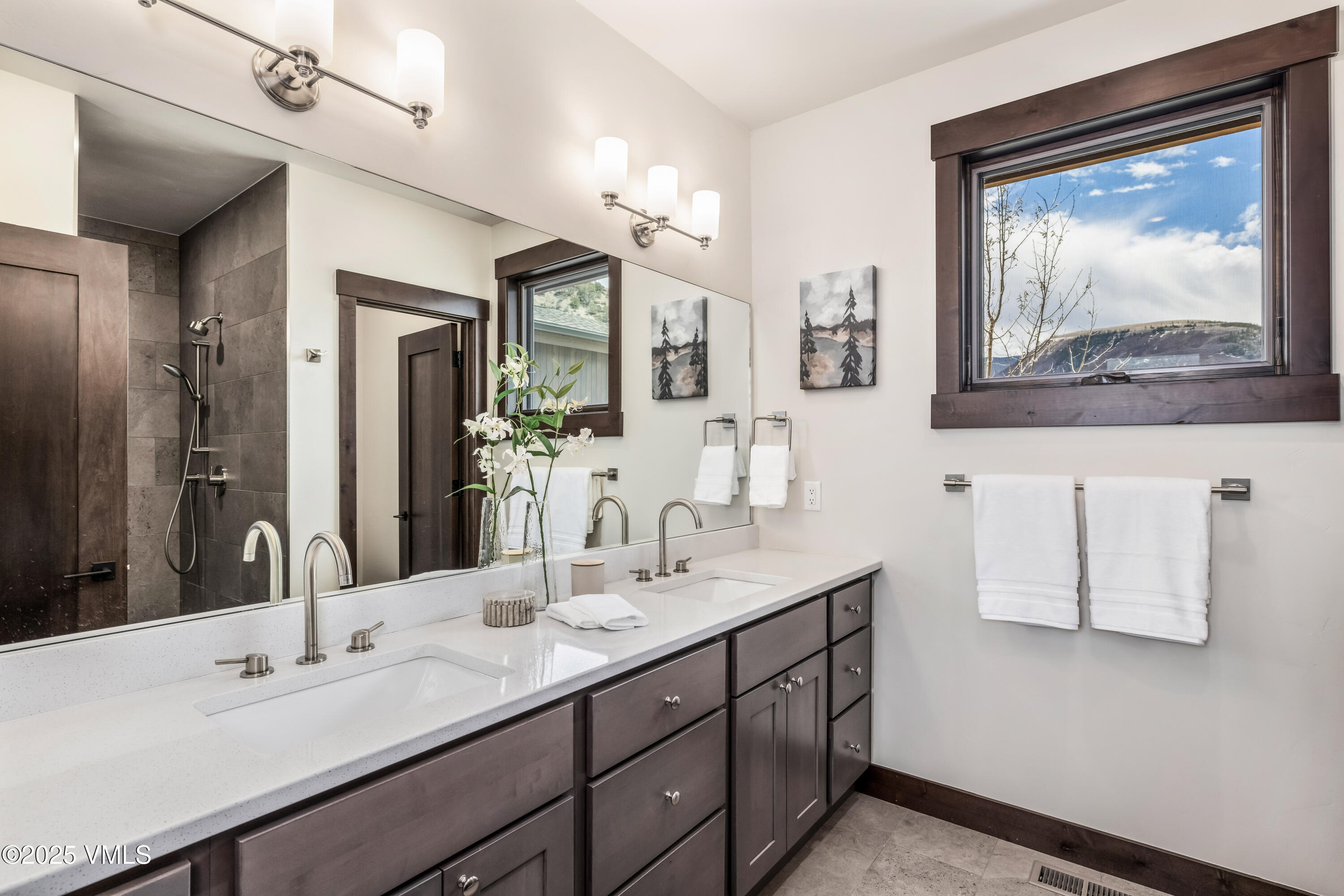 86 Hunters View Lane Eagle, CO 81631 - Photo 19 of 28 a bathroom with a double vanity sink and a mirror