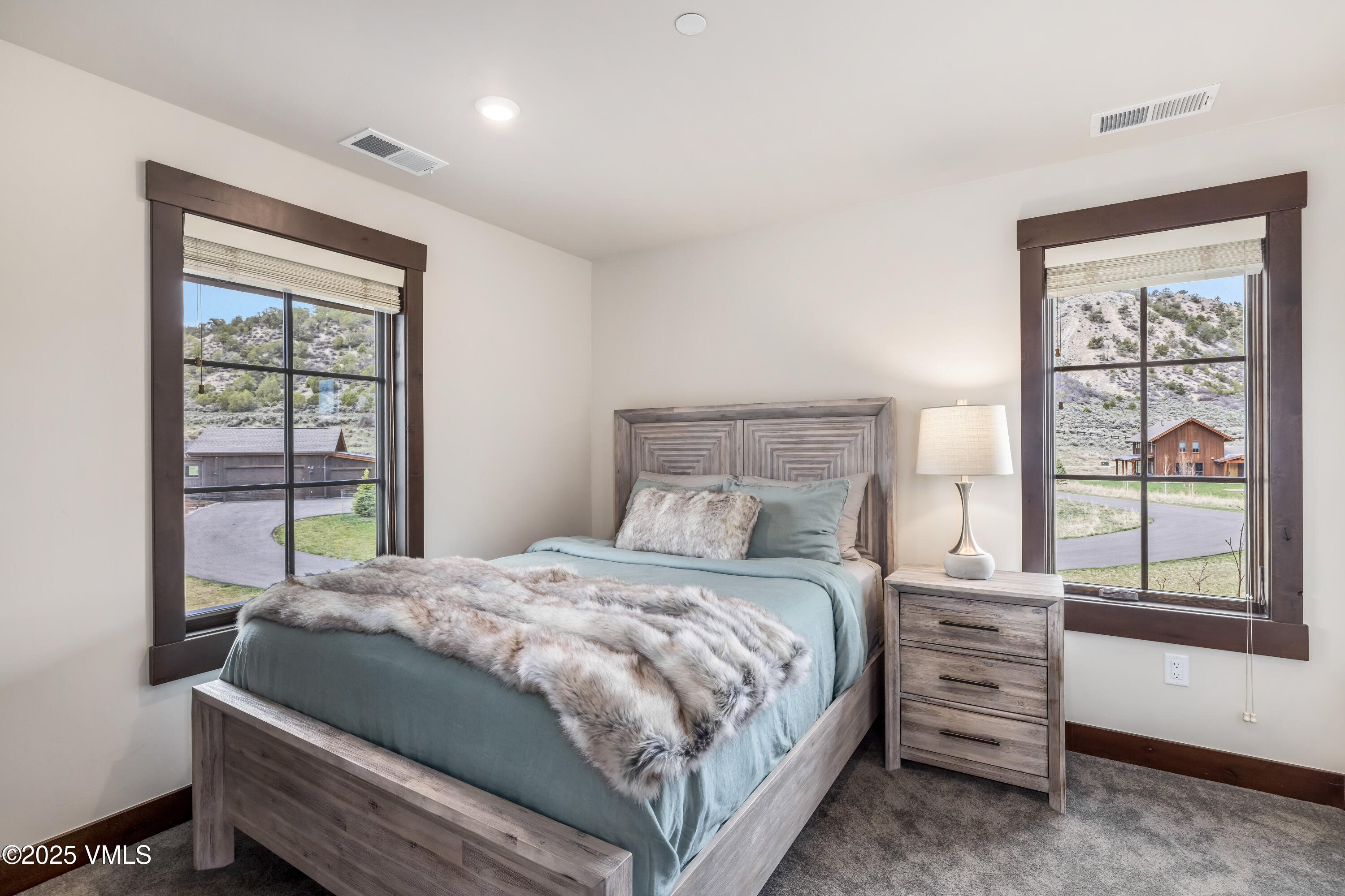 86 Hunters View Lane Eagle, CO 81631 - Photo 23 of 28 a bedroom with a bed and a window