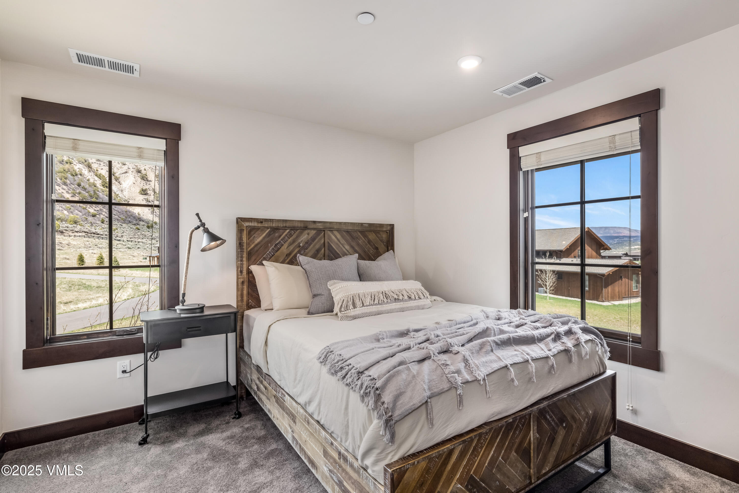 86 Hunters View Lane Eagle, CO 81631 - Photo 25 of 28 a bedroom with a bed and a window