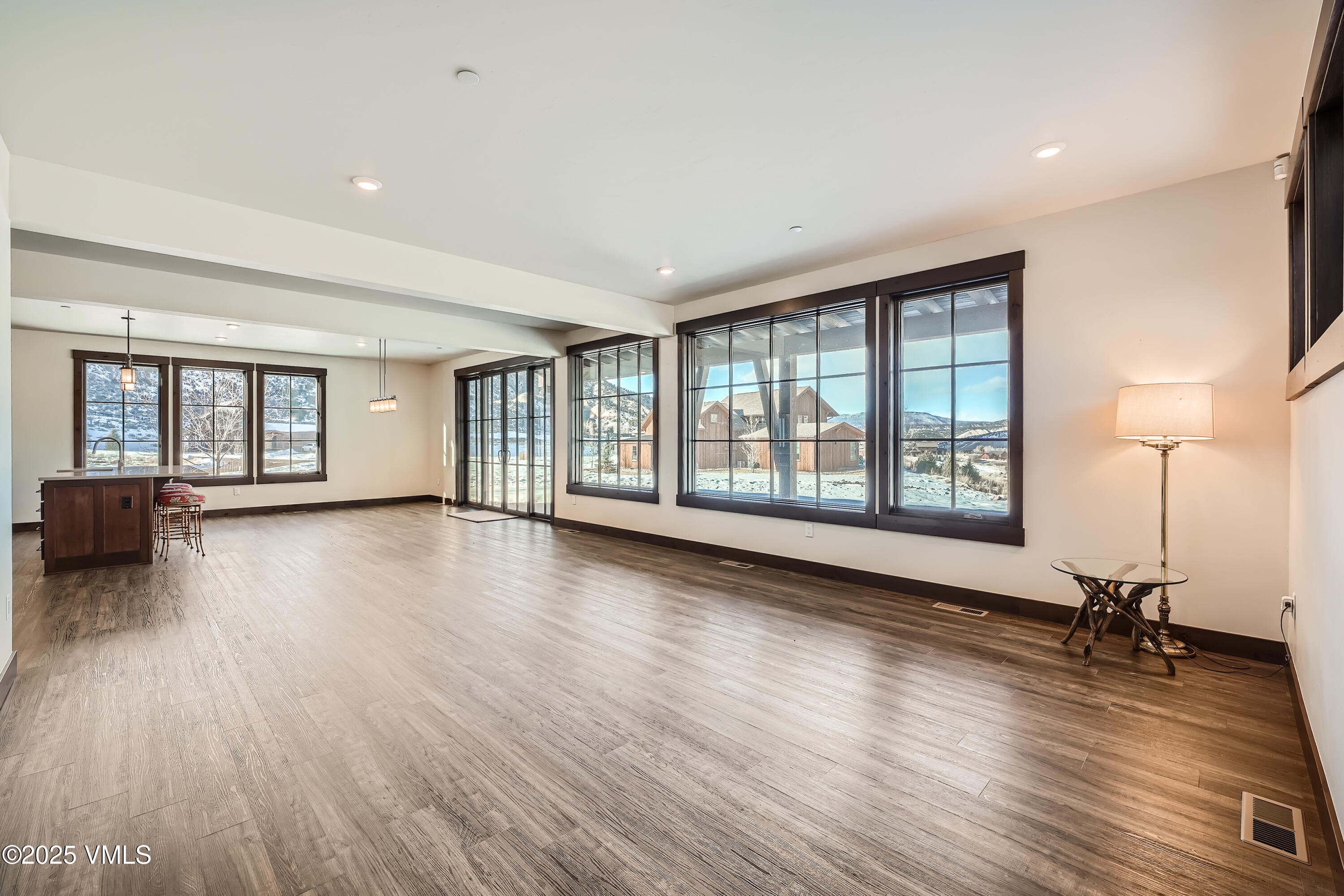 86 Hunters View Lane Eagle, CO 81631 - Photo 3 of 28 a view of an empty room with wooden floor and a window