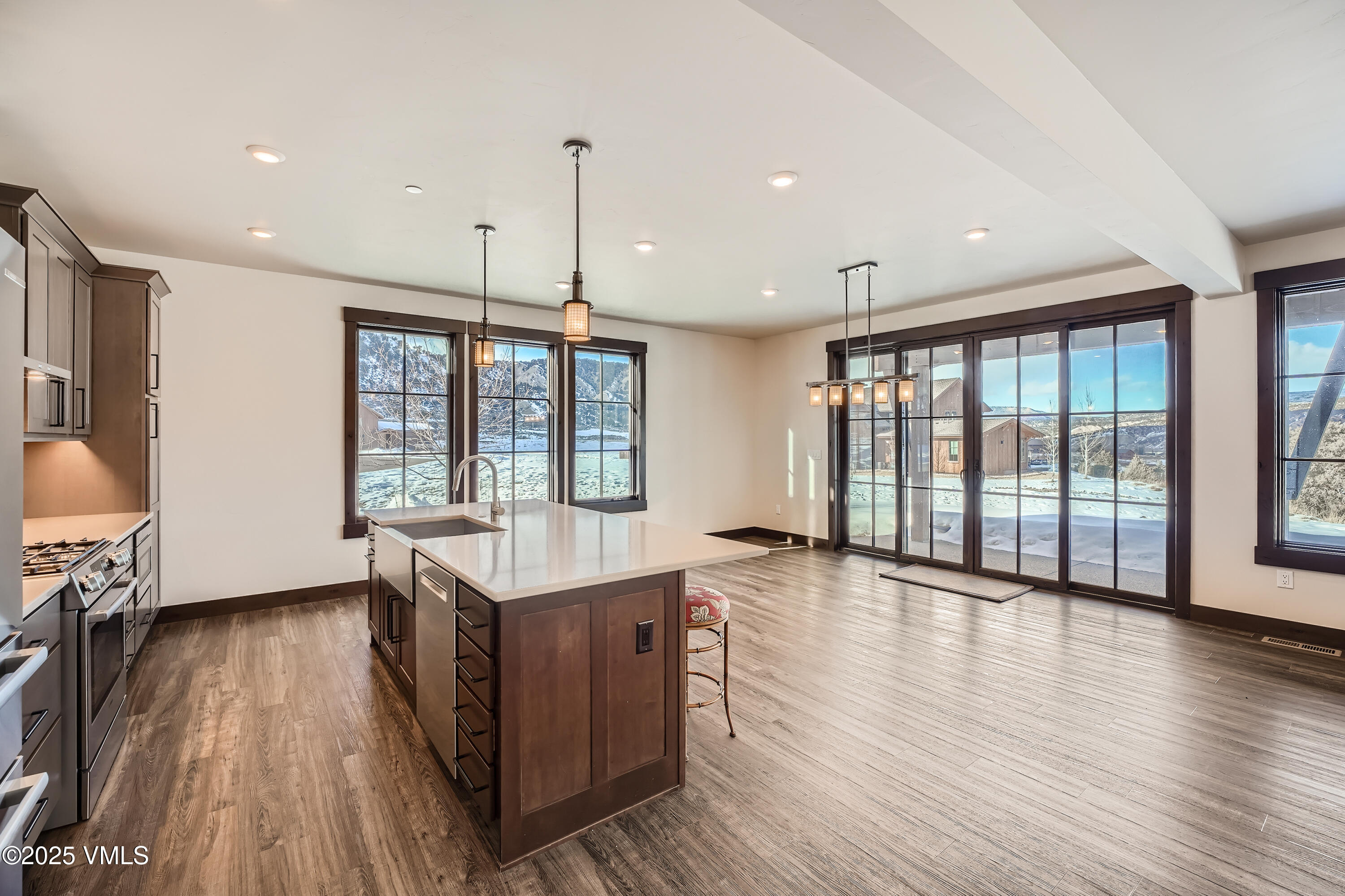 86 Hunters View Lane Eagle, CO 81631 - Photo 5 of 28 a living room with stainless steel appliances granite countertop furniture wooden floor and a large window
