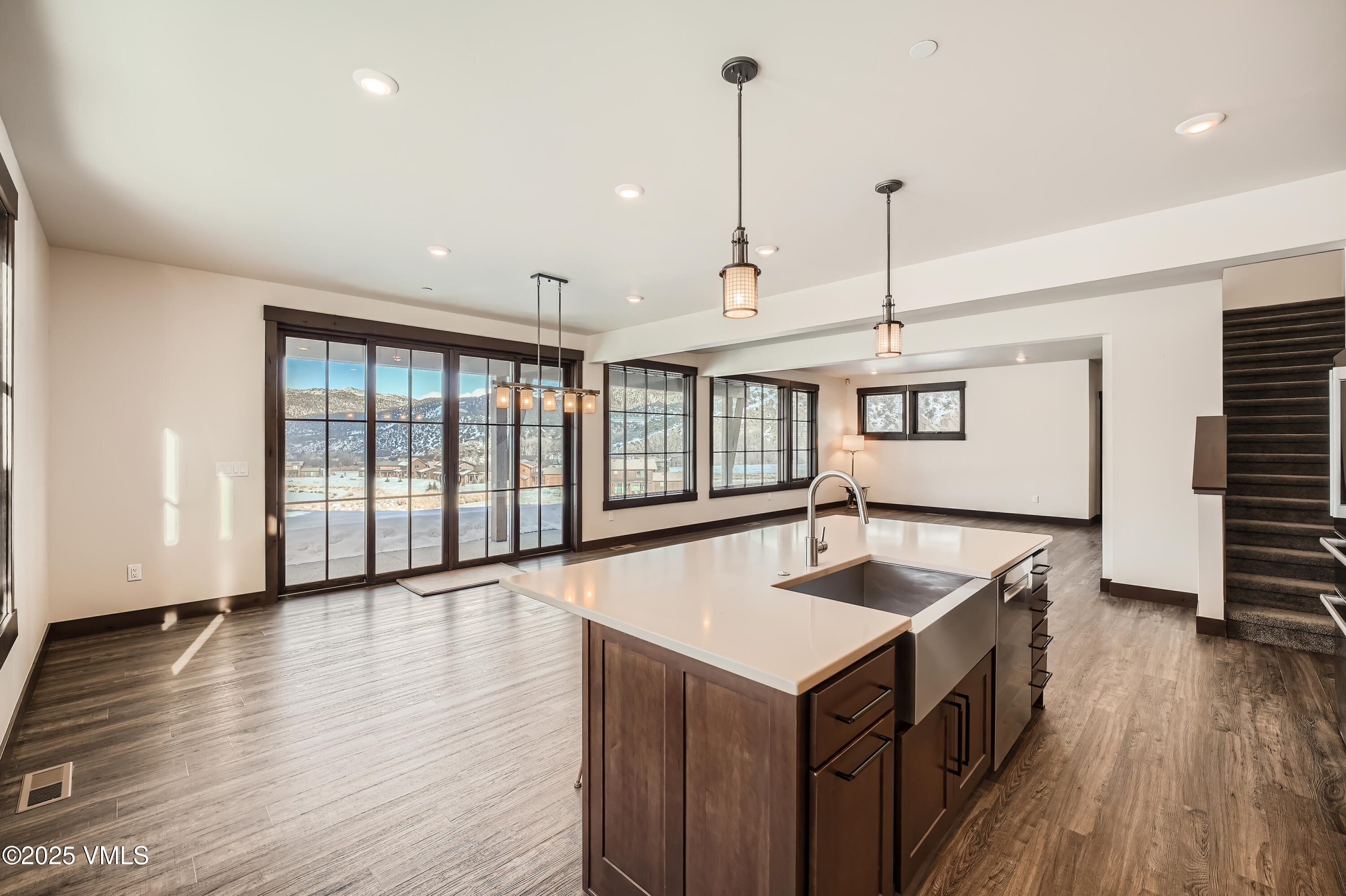 86 Hunters View Lane Eagle, CO 81631 - Photo 10 of 28 a kitchen with center island wooden floor and a center island