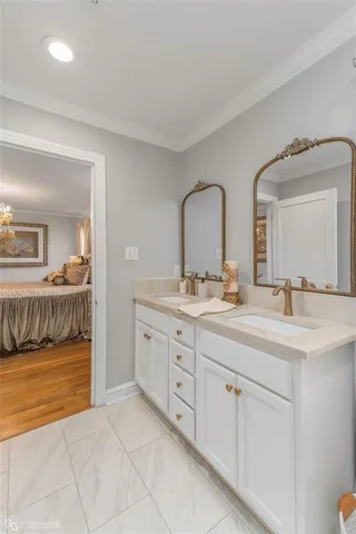 a spacious bathroom with a double vanity sink and a mirror