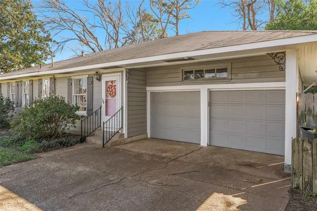 a front view of a house with garage
