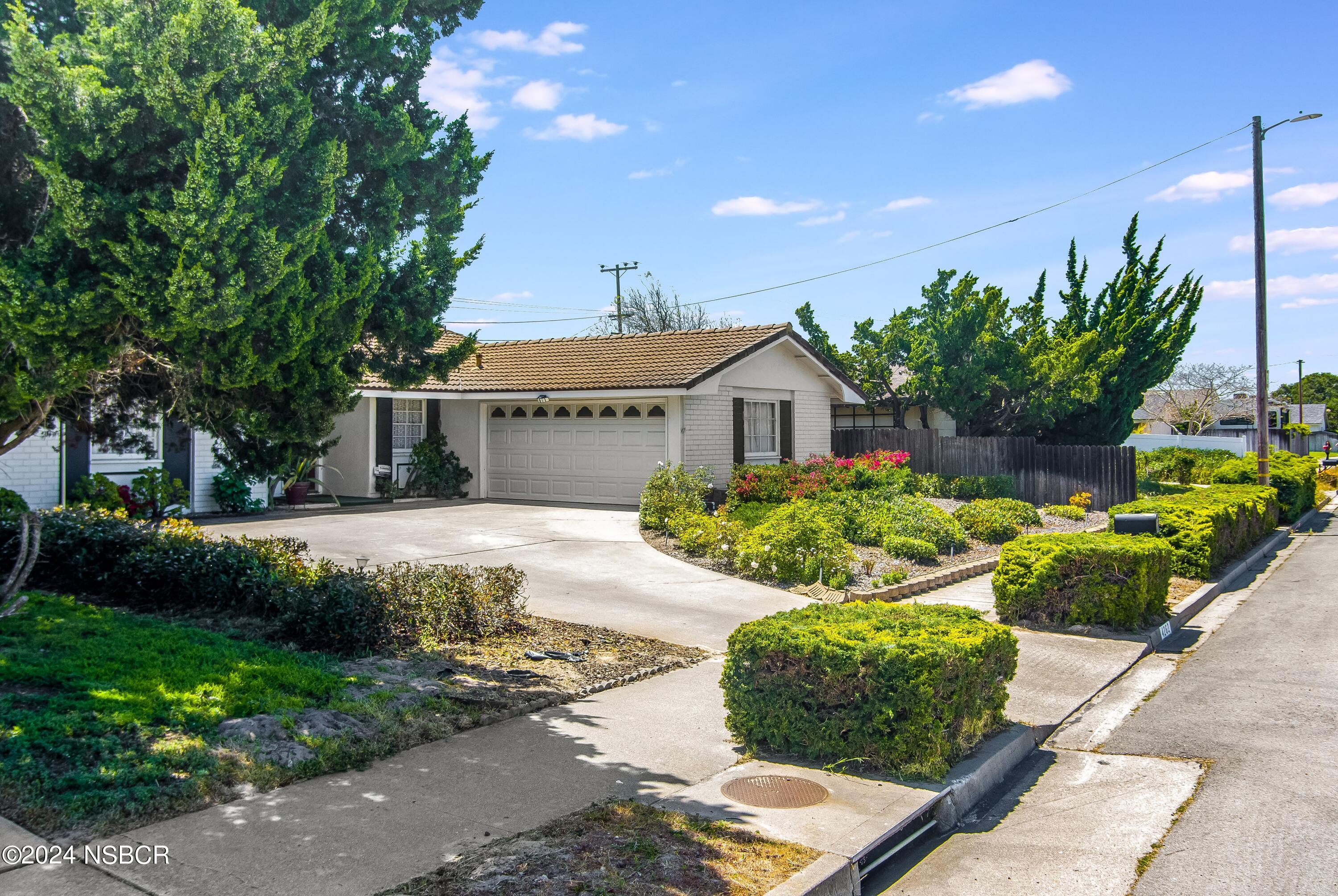 4262 Rigel Avenue Lompoc, CA 93436 - Photo 4 of 27 a front view of a house with a yard