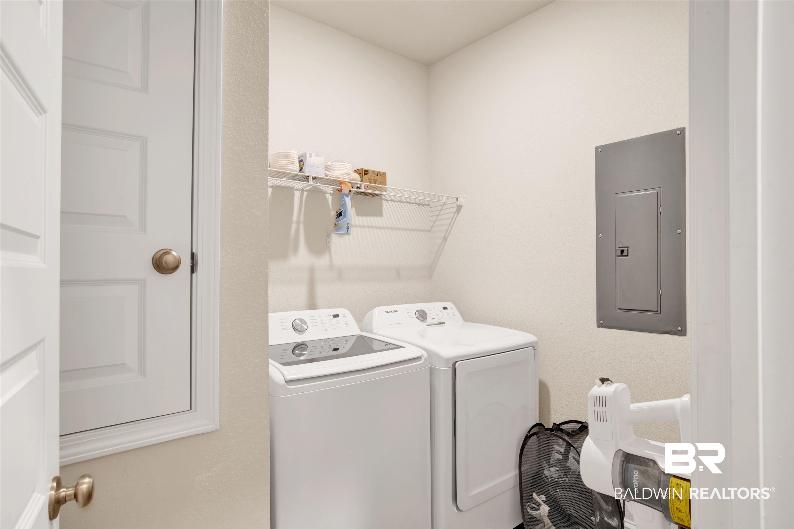 9622 Volterra Avenue Daphne, AL 36526 - Photo 24 of 31 Laundry area with electric panel and washing machine and dryer