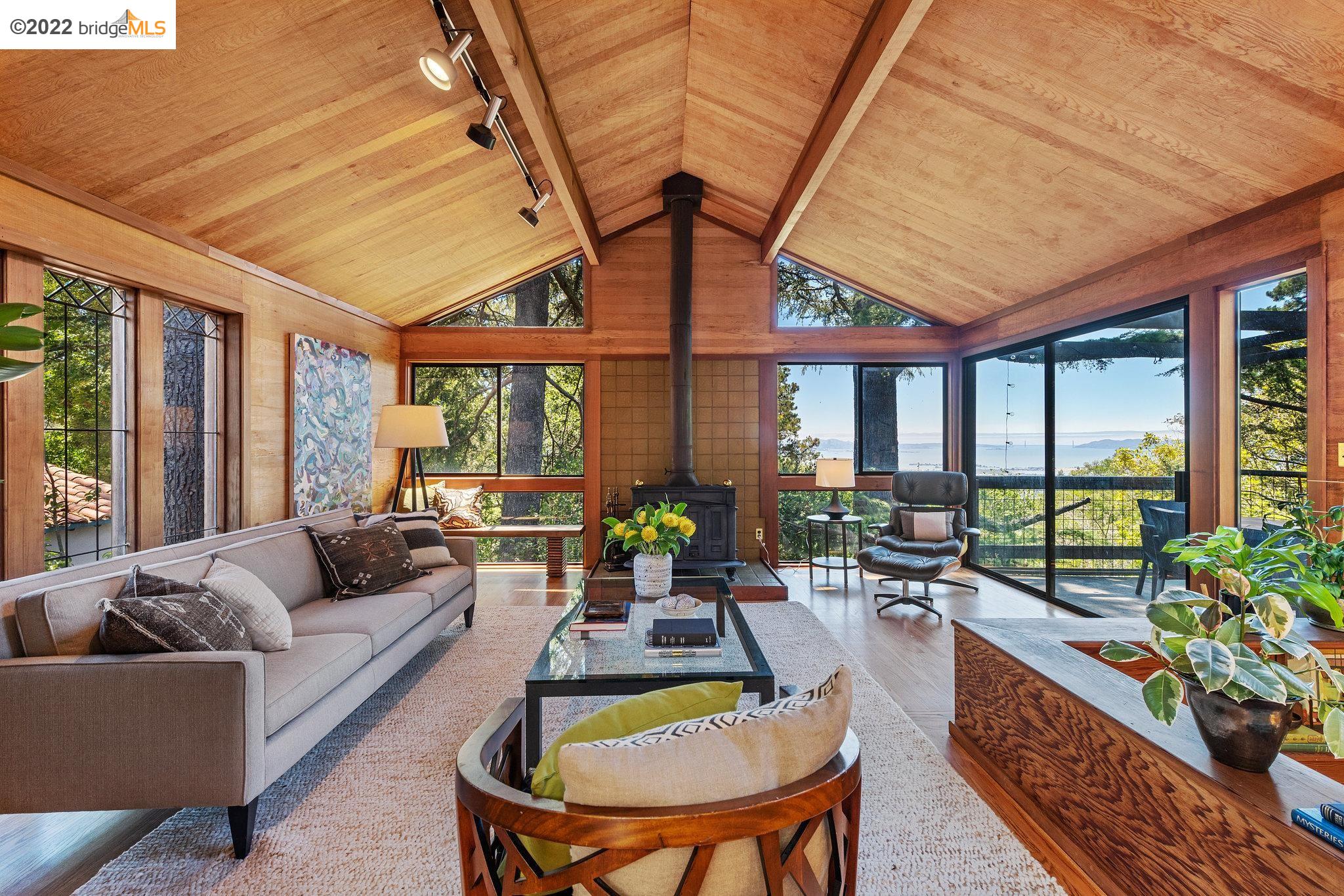 1176 Keeler Avenue Berkeley, CA 94708 - Photo 1 of 1 a living room with furniture and a large window