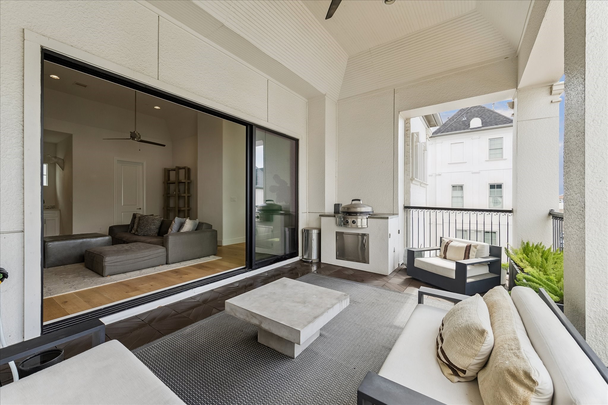 6108 Nicholas Grove Place Houston, TX 77055 - Photo 23 of 29 Looking back inside, you can see how the fully opened stacking glass doors create one expansive space, blending the game room and roof deck into a single entertaining area.