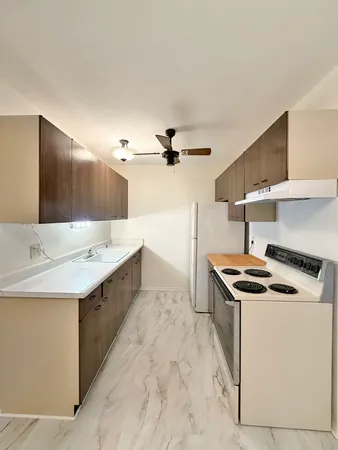 a kitchen that has a sink and a stove