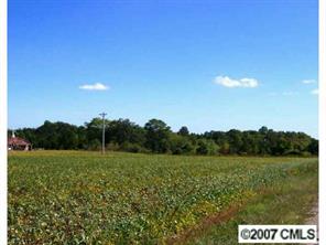 3 Hall Road Mount Ulla, NC 28125 - Photo 1 of 3 a view of a green field with trees in the background