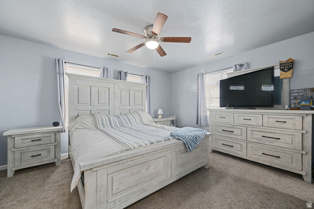 348 North Lodge Road Central, UT 84722 - Photo 24 of 25 Bedroom featuring dark colored carpet and ceiling fan