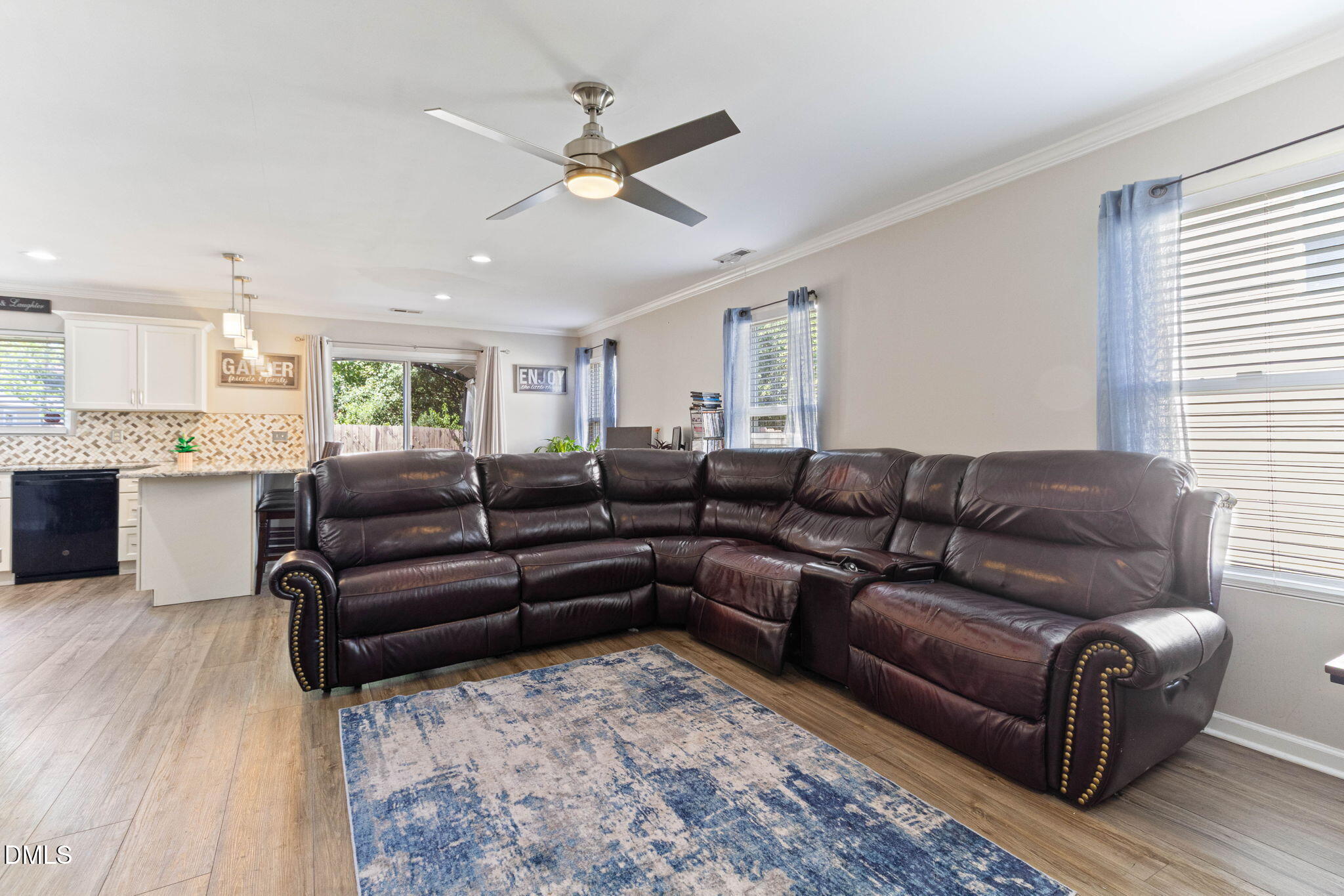 3713 Marshlane Way Raleigh, NC 27610 - Photo 7 of 38 a living room with furniture and a wooden floor