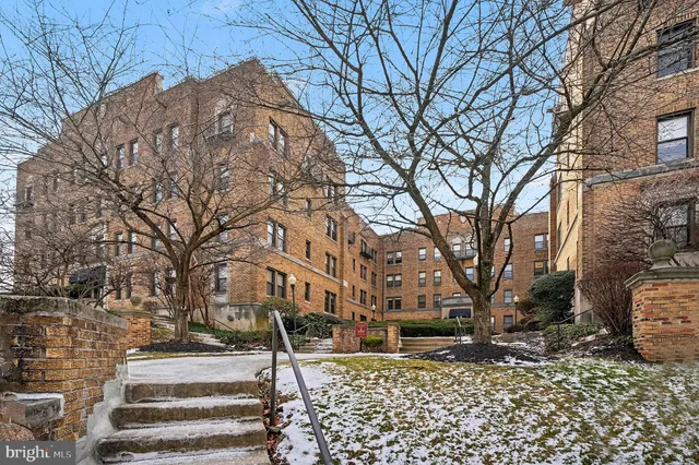 a view of a building with a yard