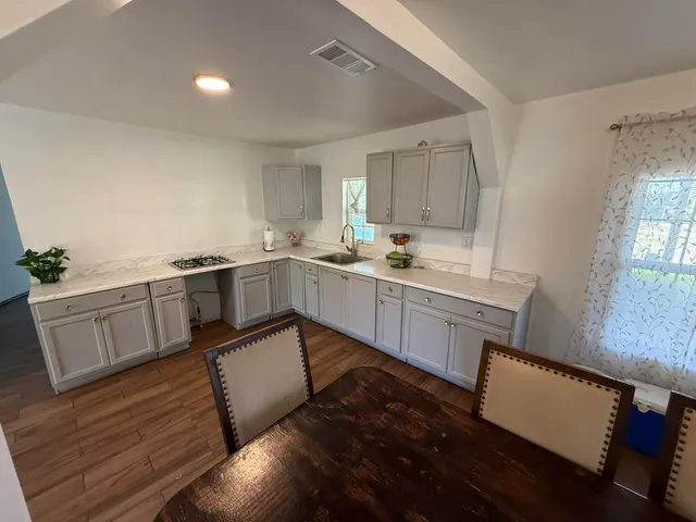 a kitchen with a sink and cabinets