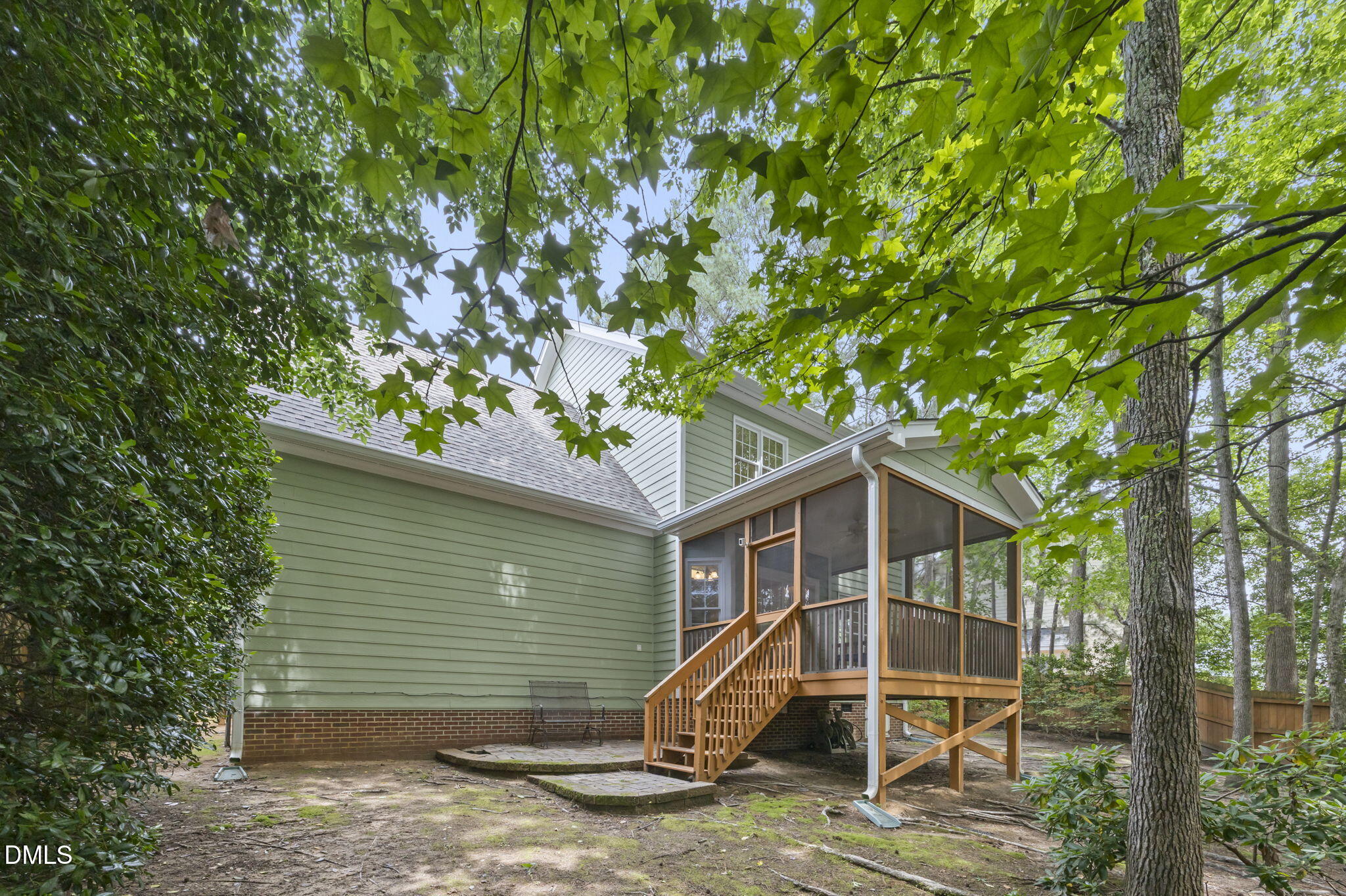 1008 Scotts Ridge Trail Apex, NC 27502 - Photo 6 of 57 a view of a wooden house with a yard