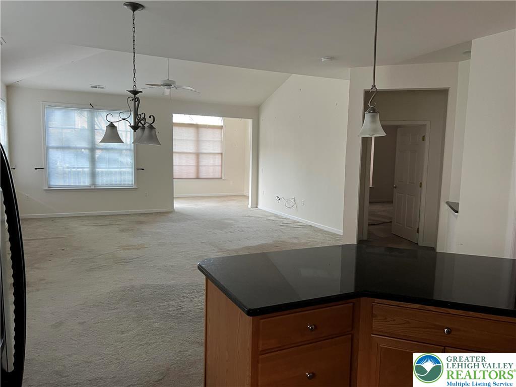 6960 Constitution Drive Bethlehem, PA 18017 - Photo 14 of 18 a kitchen with kitchen island a counter top space appliances and cabinets