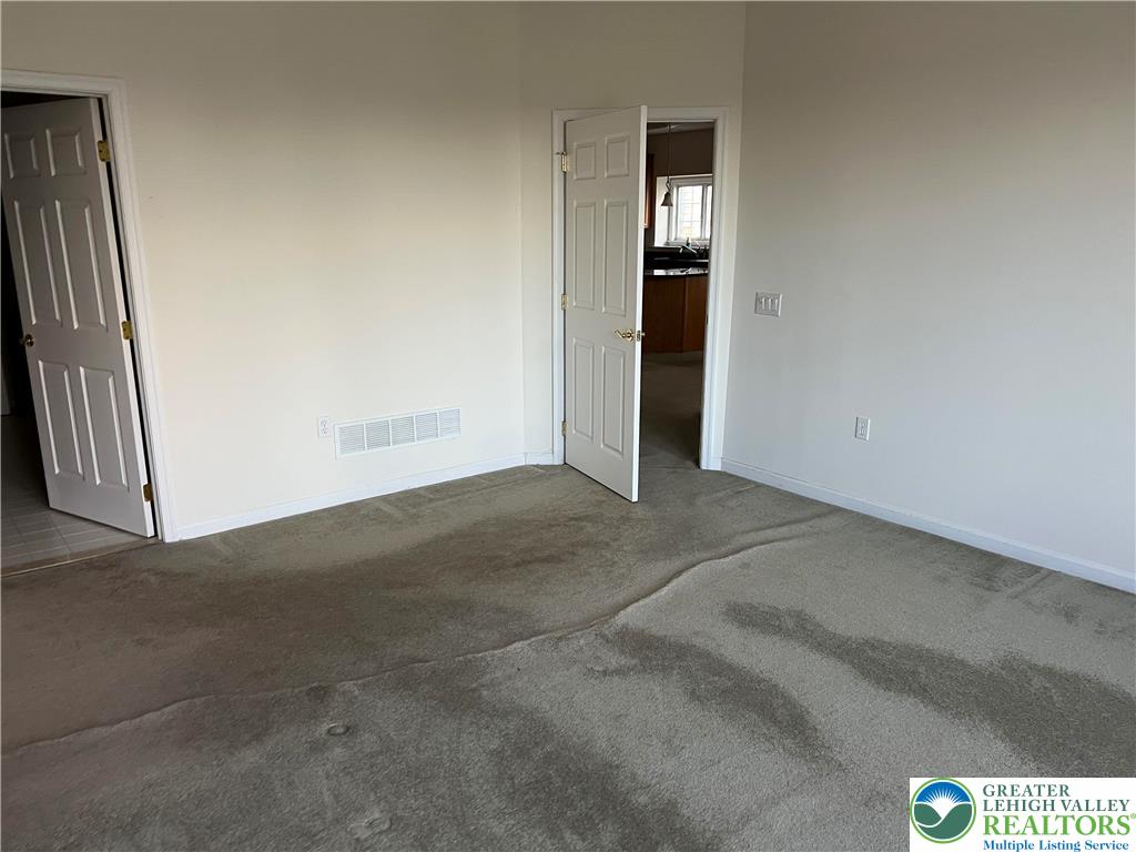 6960 Constitution Drive Bethlehem, PA 18017 - Photo 18 of 18 an empty room with closet and windows
