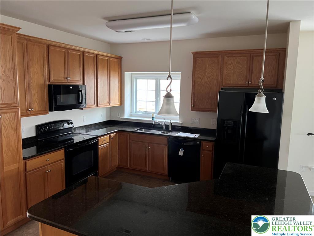 6960 Constitution Drive Bethlehem, PA 18017 - Photo 6 of 18 a kitchen with a sink and a stove top oven