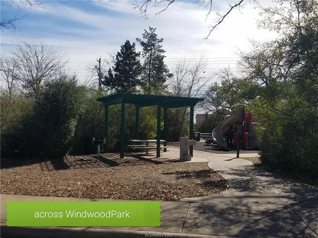 a kitchen with a refrigerator and a sink