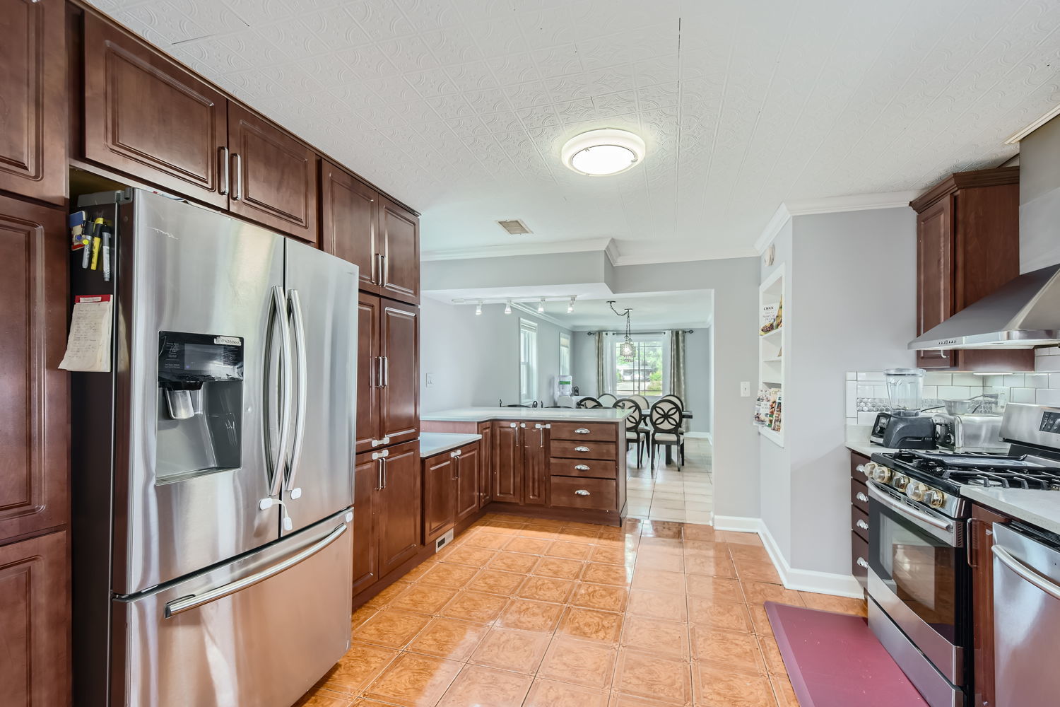 836 Spring Road Elmhurst, IL 60126 - Photo 12 of 31 a kitchen with stainless steel appliances granite countertop a refrigerator and a stove top oven