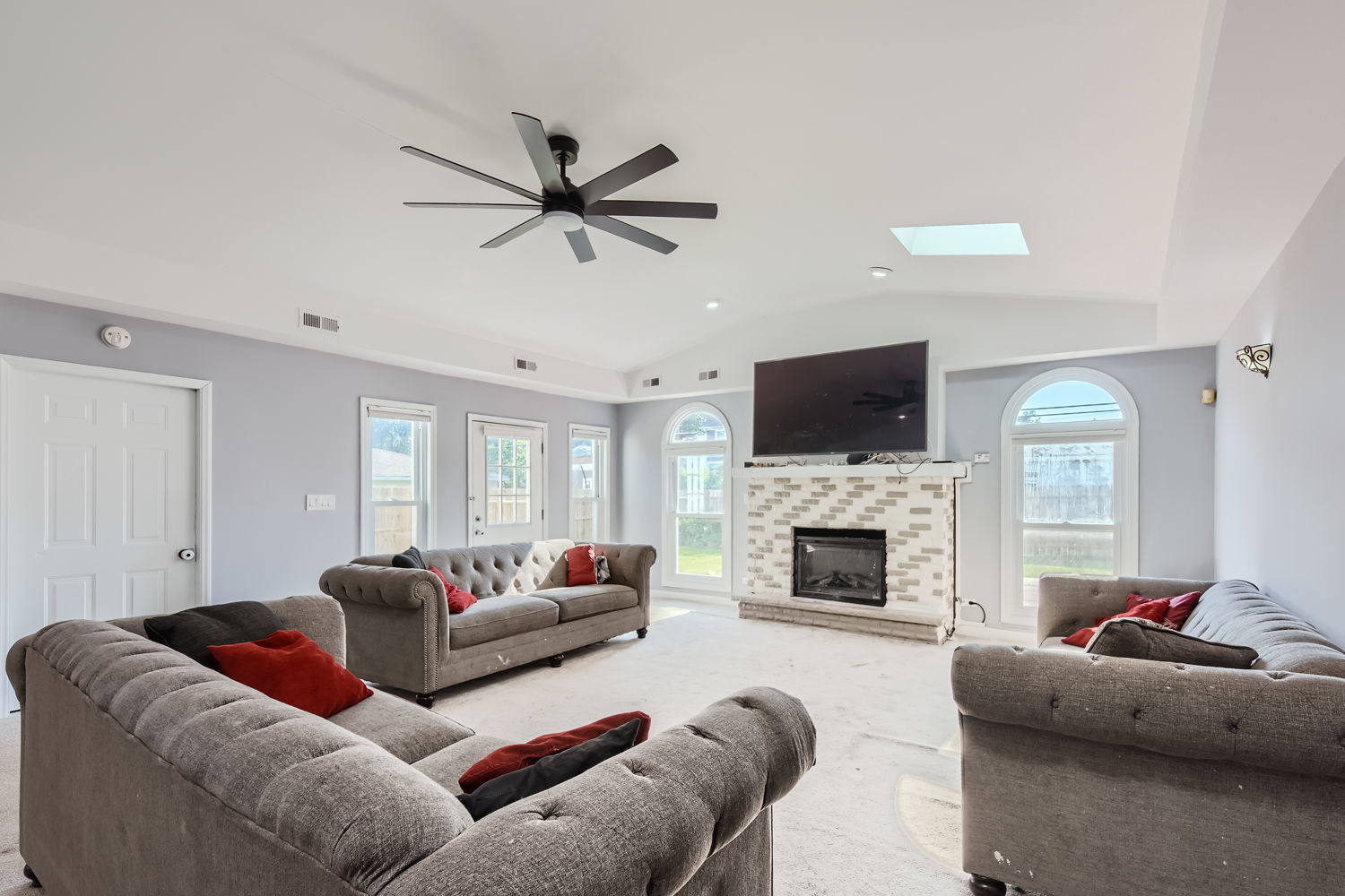 836 Spring Road Elmhurst, IL 60126 - Photo 13 of 31 a living room with furniture flat screen tv and a fireplace