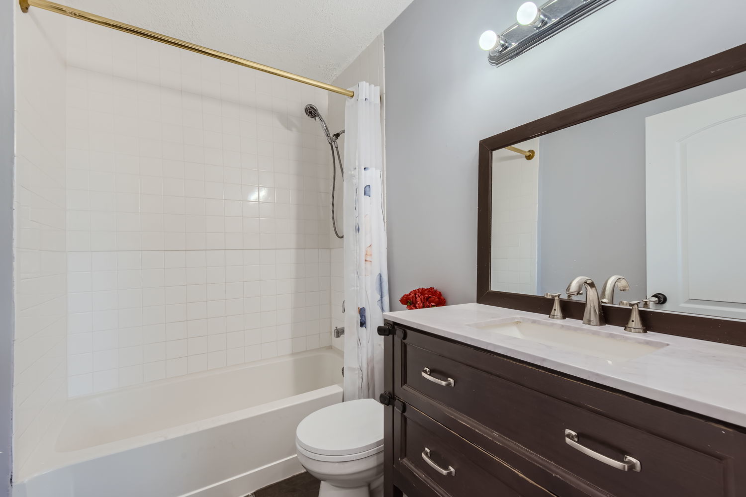 836 Spring Road Elmhurst, IL 60126 - Photo 19 of 31 a bathroom with a granite countertop sink toilet and shower