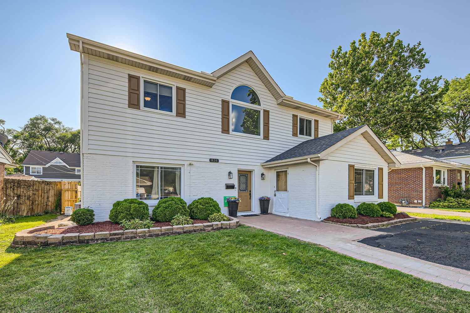 836 Spring Road Elmhurst, IL 60126 - Photo 2 of 31 a front view of a house with a yard and garage