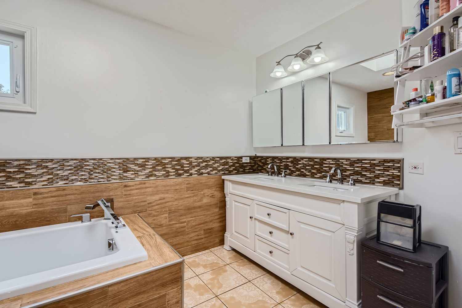 836 Spring Road Elmhurst, IL 60126 - Photo 25 of 31 a bathroom with a sink and a bathtub