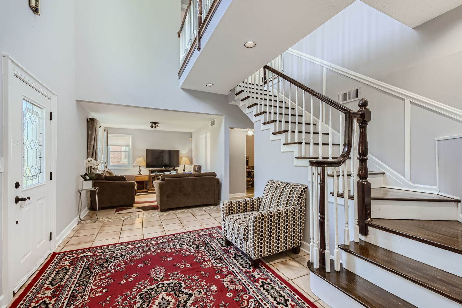 836 Spring Road Elmhurst, IL 60126 - Photo 4 of 31 a living room with furniture or couch and a rug