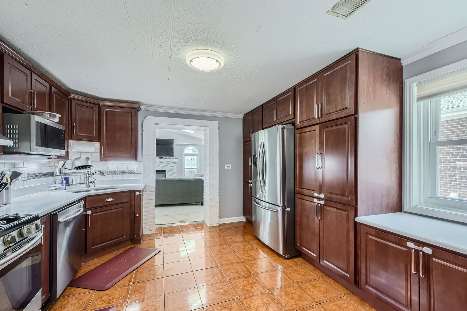 836 Spring Road Elmhurst, IL 60126 - Photo 10 of 31 a kitchen with stainless steel appliances granite countertop a refrigerator and a sink