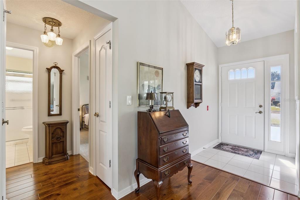 26450 Evert Street Leesburg, FL 34748 - Photo 17 of 93 a living room with furniture a fireplace and a chandelier