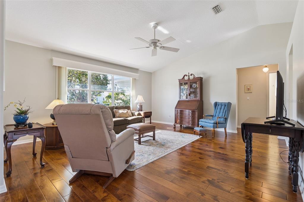 26450 Evert Street Leesburg, FL 34748 - Photo 18 of 93 a living room with furniture and wooden floor