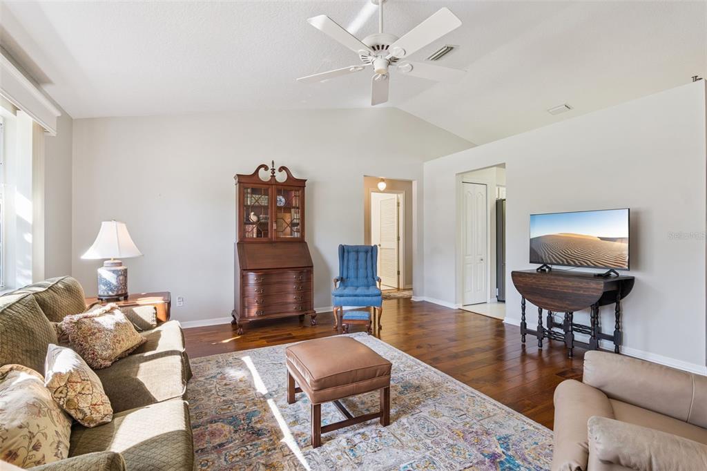 26450 Evert Street Leesburg, FL 34748 - Photo 19 of 93 a living room with furniture and wooden floor