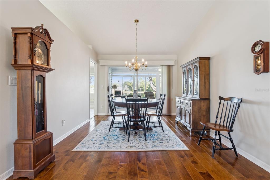 26450 Evert Street Leesburg, FL 34748 - Photo 22 of 93 a view of a dining room with furniture window and wooden floor