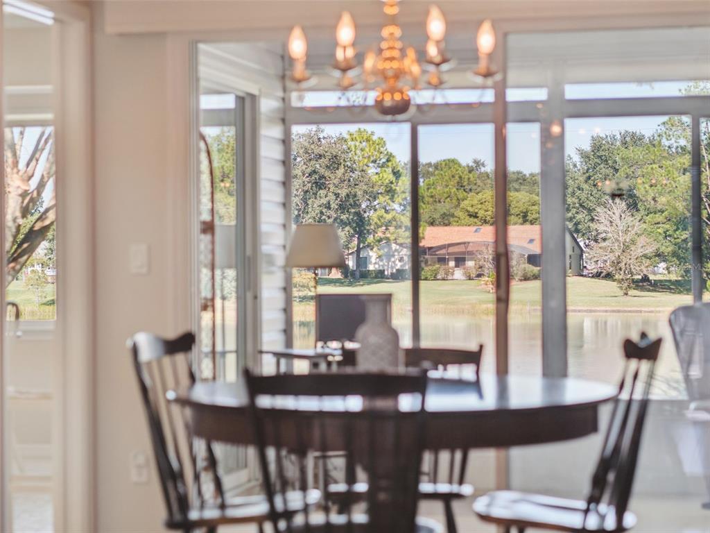 26450 Evert Street Leesburg, FL 34748 - Photo 23 of 93 a view of a dining room with furniture window and outside view