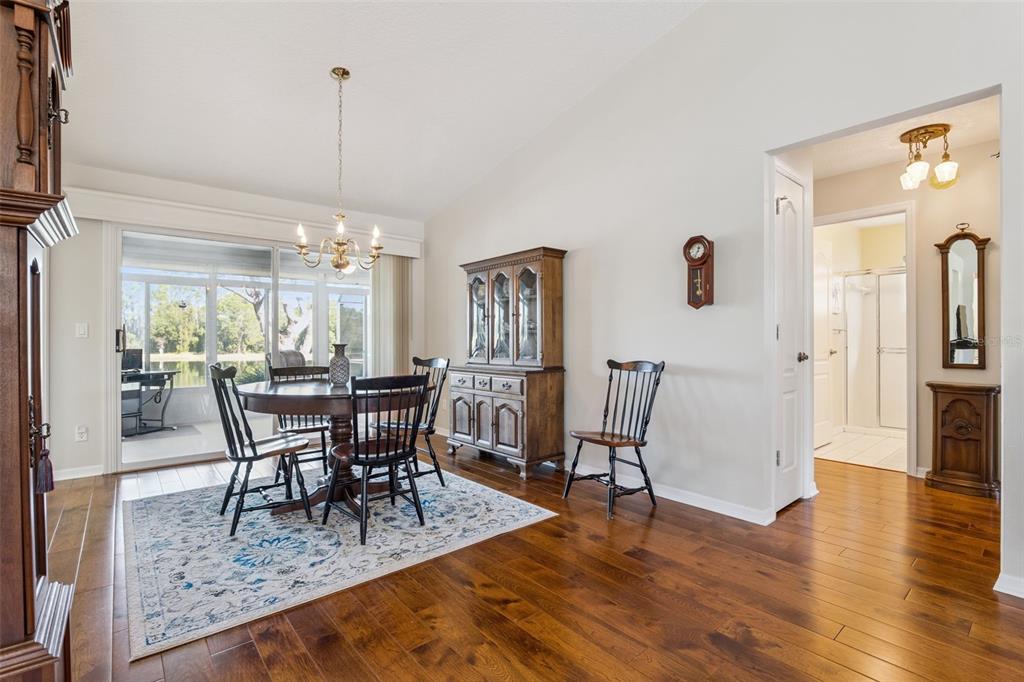 26450 Evert Street Leesburg, FL 34748 - Photo 24 of 93 a view of a dining room with furniture window and wooden floor