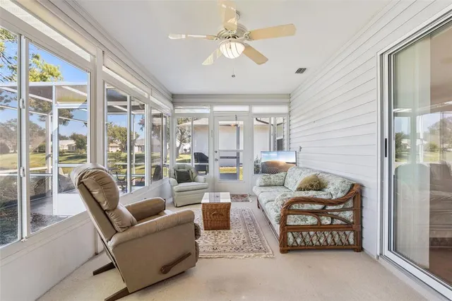 an aerial view of residential houses with outdoor space and street view