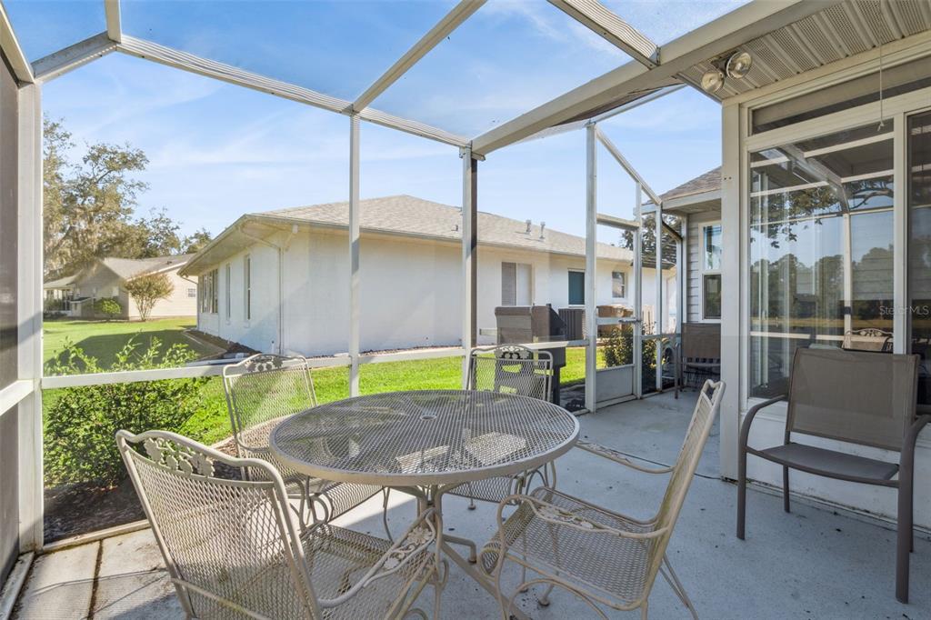 26450 Evert Street Leesburg, FL 34748 - Photo 44 of 93 a view of an outdoor sitting area in a backyard