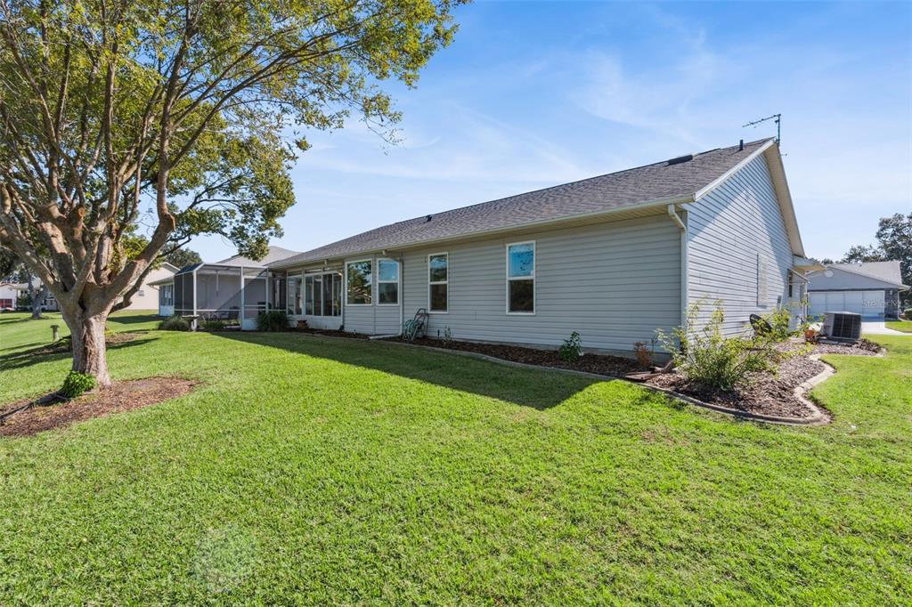 26450 Evert Street Leesburg, FL 34748 - Photo 46 of 93 a front view of house with yard and green space