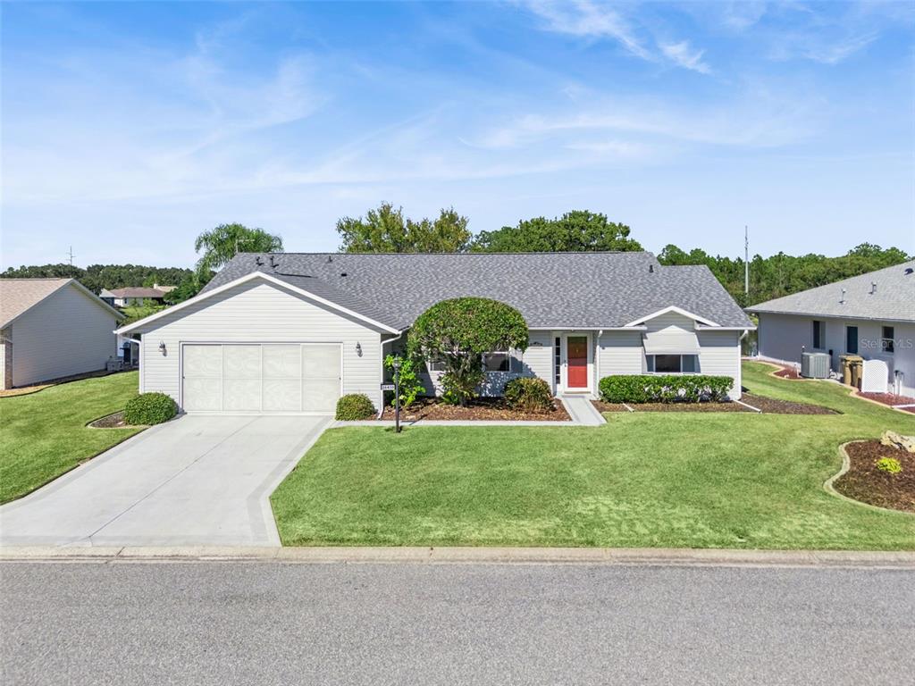 26450 Evert Street Leesburg, FL 34748 - Photo 6 of 93 front view of house with a yard